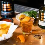 Winter drinks selection including whisky, port, and wine arranged for cozy evening drinking