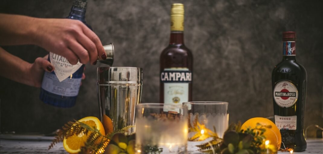 Bottles of Campari alternatives and Italian aperitivo liqueurs arranged on a dark winter background
