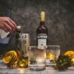 Bottles of Campari alternatives and Italian aperitivo liqueurs arranged on a dark winter background