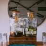 Pimms No.1 bottle with fresh fruit garnish and ice in a glass, classic summer serve style